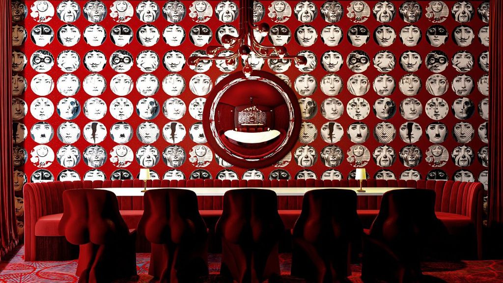 Maison Dali - Surrealist fine dining room with signature red wallpaper featuring expressive faces